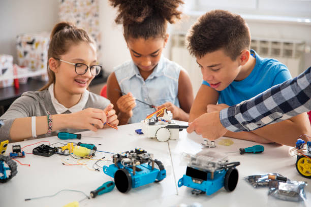 Kids working on a robot design at classroom